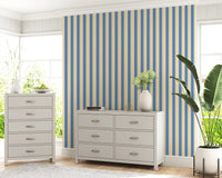 Coastal-themed blue stripe wallpaper for a bright and airy interior feel.