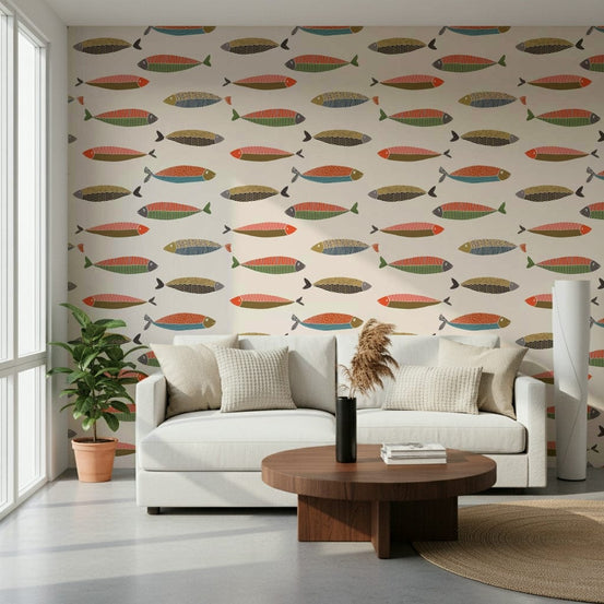 Colorful Fish Parade wallpaper of retro multicolor fish behind a white sofa in a bright living room