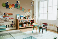 A cheerful wall mural with a whimsical, space design.


