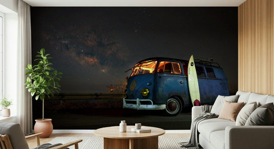 Cosmic Rides wallpaper mural of a blue VW campervan under the Milky Way above a white sectional sofa