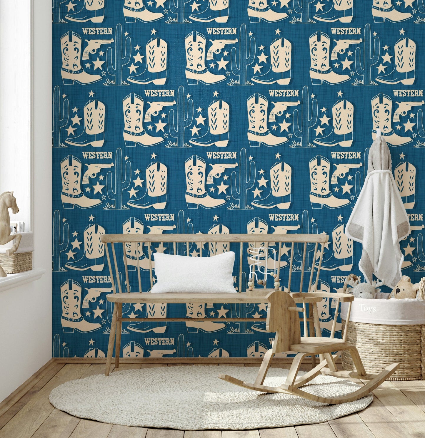 Western-themed wallpaper mural with repeating cowboy boots, cactuses, and star motifs on a textured background.