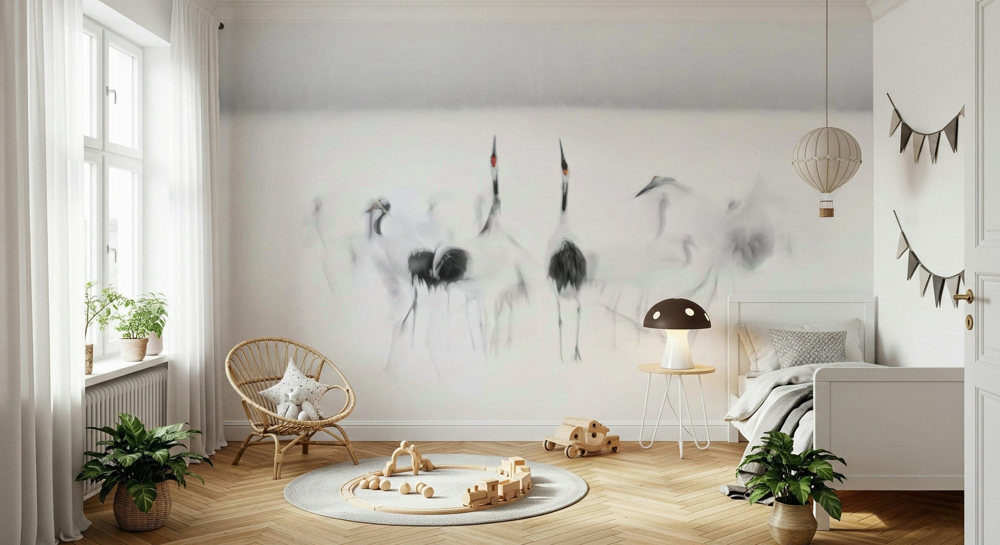Crane Dance in White wallpaper mural of ink-wash cranes behind a rattan chair and white bed in a kids room