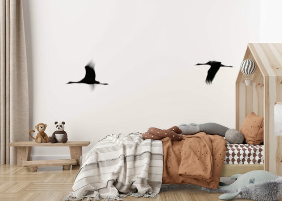 A graceful subtle bird wall mural in cool, natural tones.

