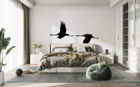 A graceful subtle bird wall mural in cool, natural tones.

