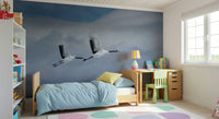 Reading nook wall mural with cranes in flight, light color tones, peaceful decor