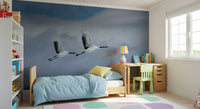 Reading nook wall mural with cranes in flight, light color tones, peaceful decor