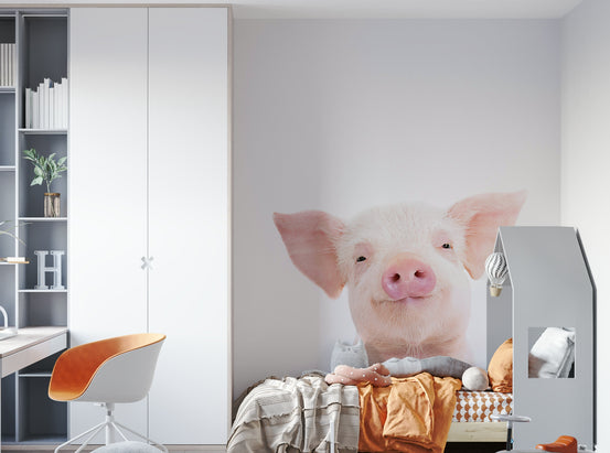 Baby Piglet wallpaper mural of a smiling pink piglet in a kids room with white wardrobe and bed