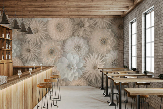 Lush Dahlia Tapestry wallpaper mural of cream 3D dahlias above a wooden bar counter and stools in a brick-walled cafe