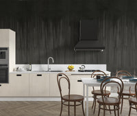 Matte charcoal wallpaper creating dramatic room mood