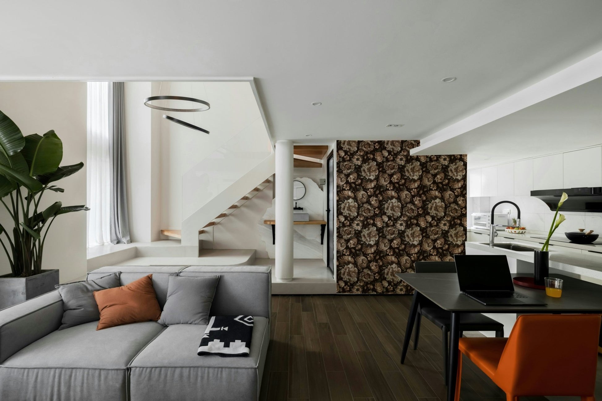 A wall mural of a dark and moody floral pattern.

