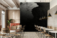 A bedroom with the moody mural behind the headboard.

