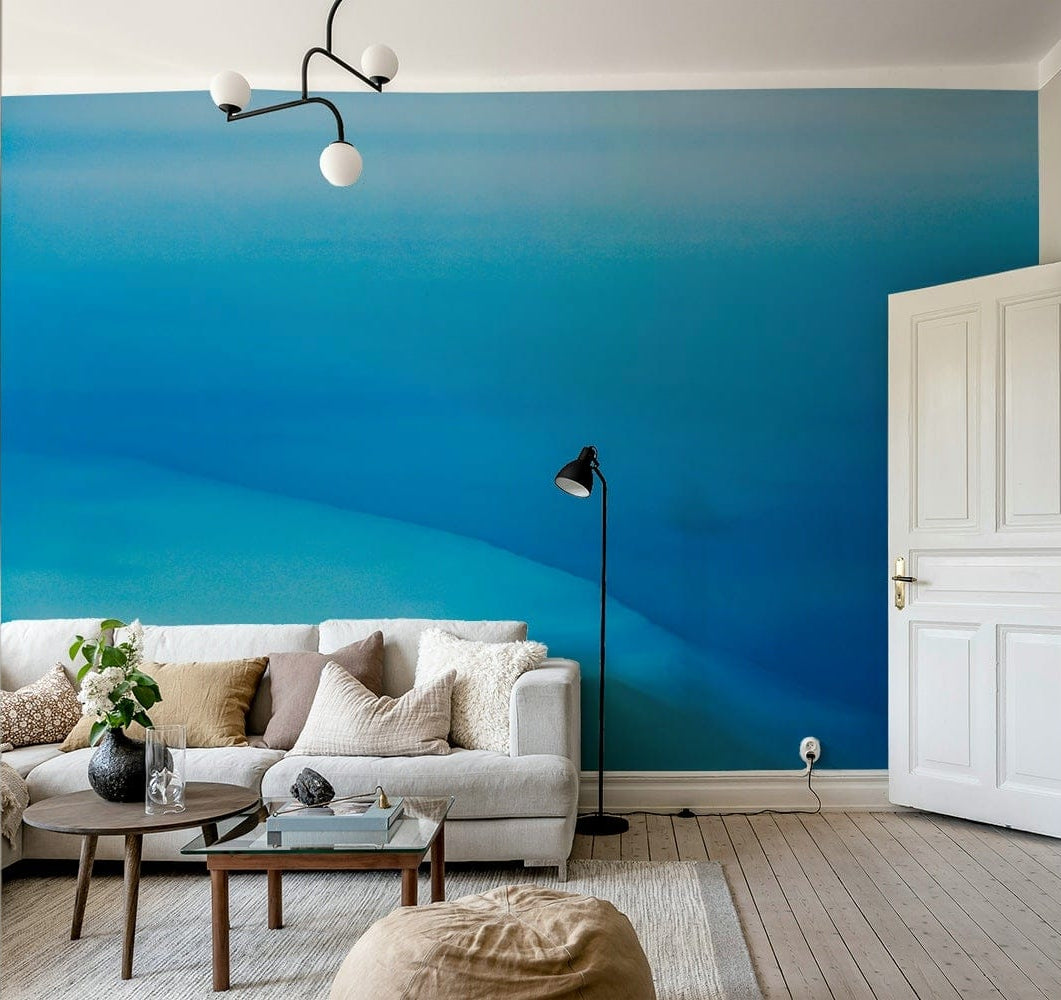 An artistic desert landscape mural on minimalist wallpaper.

