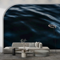 Ocean-inspired wallpaper showcasing dynamic waves in deep blue tones.