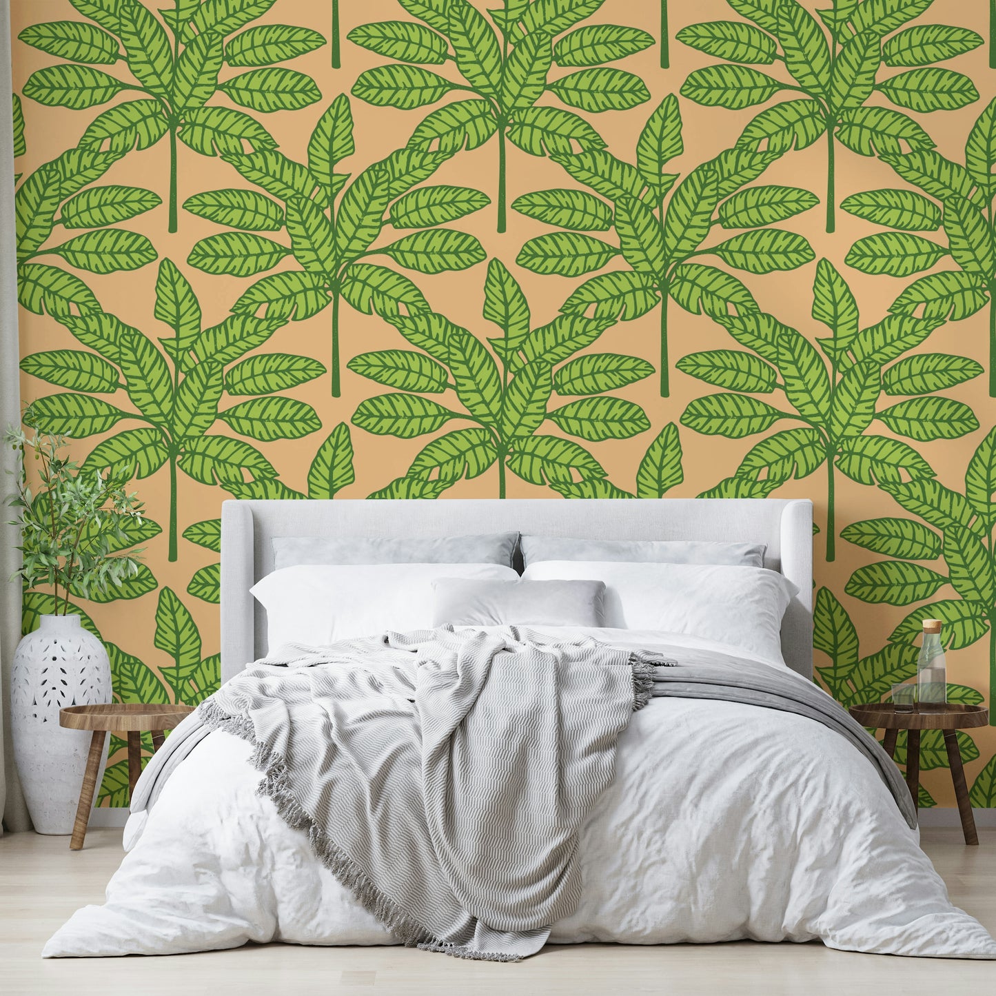 Wallpaper with desert oasis leaves in green and orange for a lively space.

