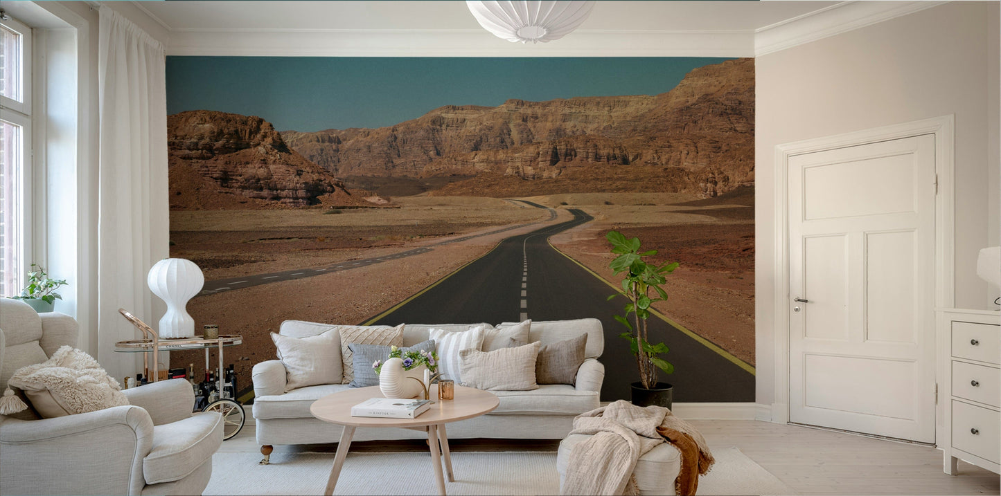 A close-up of the winding road amidst rocky formations.

