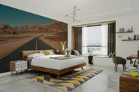 A beautiful desert road stretching through a vast landscape.

