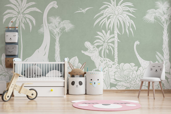 Monochrome Dino Green wallpaper mural with white dinosaurs and palms in a nursery with a white crib and balance bike
