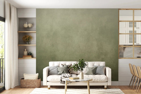 Dirty Paper - Ombre Olive wallpaper mural in sage green behind a cream tufted sofa and round marble table