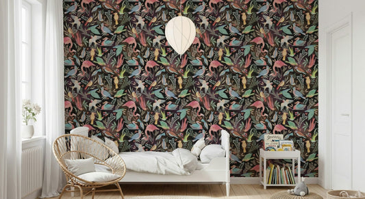 Dream Dark Birdwatcher's wallpaper of birds on a dark ground behind a white bed and rattan peacock chair