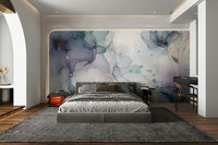 Large scale floral mural behind a cream sofa in a modern apartment.