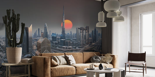 Dubai Skyline During Sunrise wallpaper mural behind a camel leather sofa and tall cactus in a living room