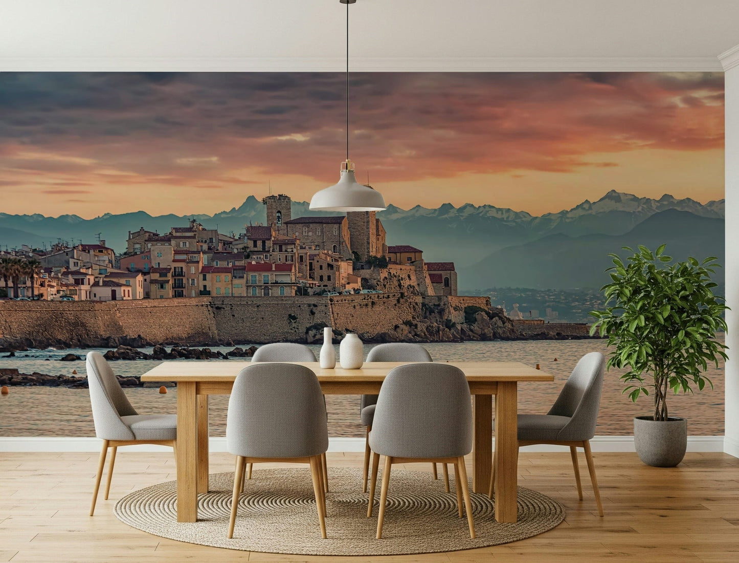 Evening mural of Antibes with soft pastel clouds over historic towers and terracotta rooftops.