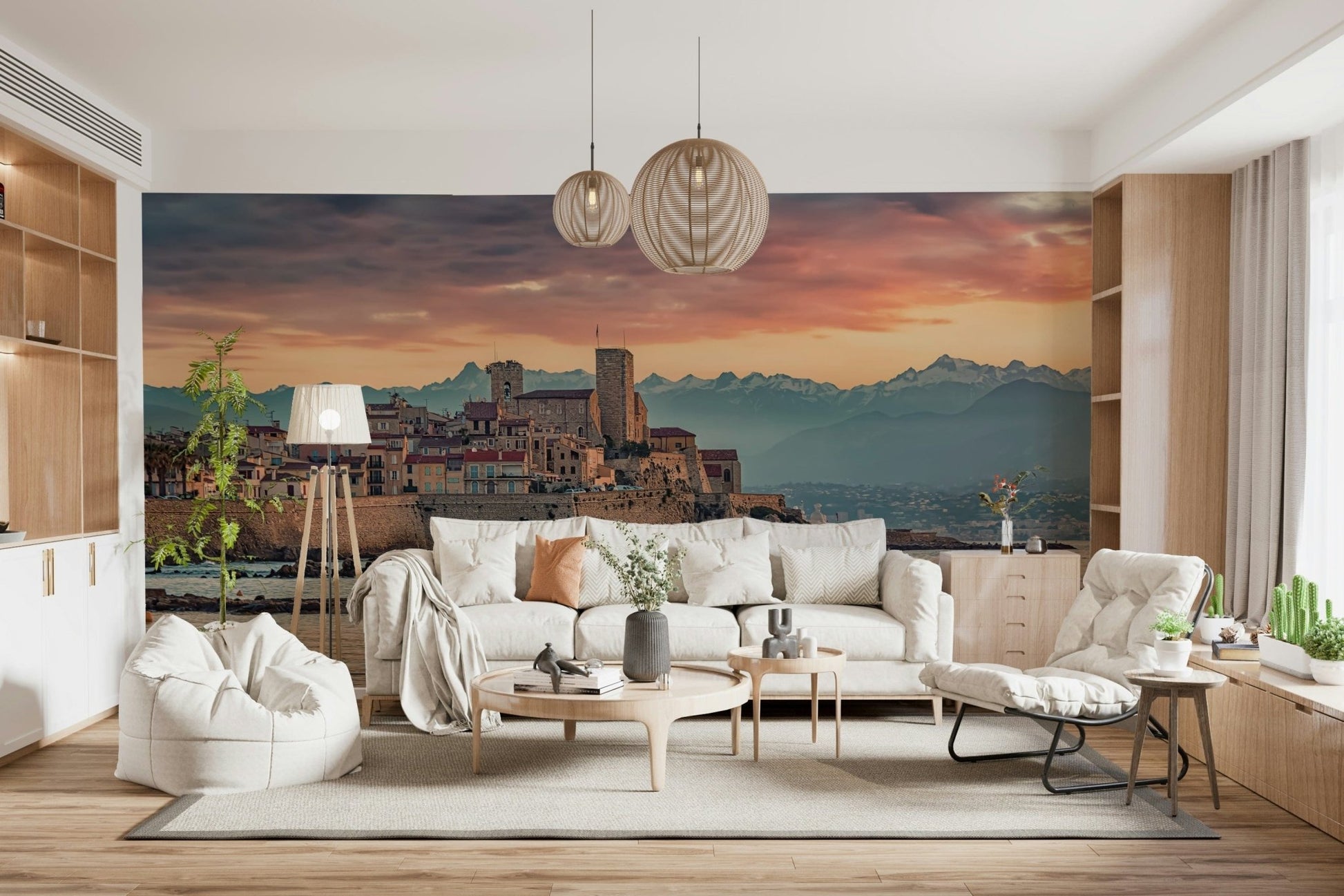 Twilight mural capturing the warm glow over Antibes’ coastal stone structures and mountains beyond.