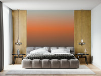 Stunning wall mural with an ethereal blue, orange, and gray gradation.