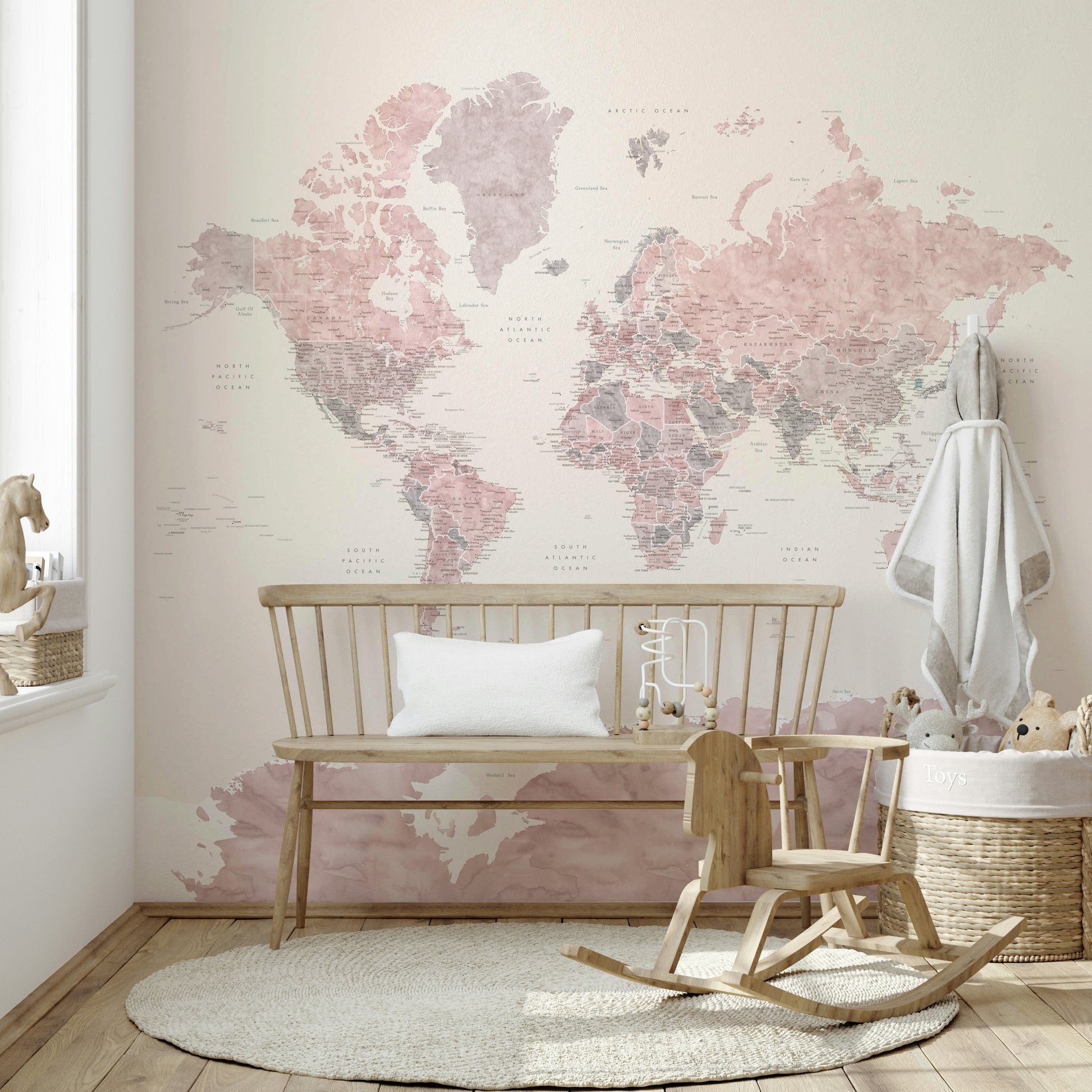 Subtle pink world map mural for serene wall décor

