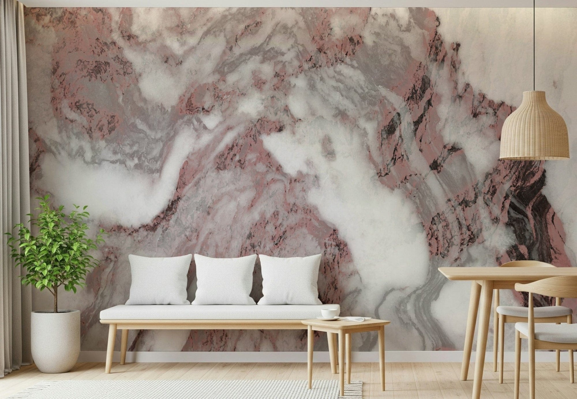 Dusty Rose Marble Swirl wallpaper mural behind a wood bench with white pillows and a leafy potted tree