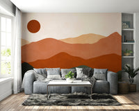 The design uses layered, geometric shapes to represent mountain ranges.

