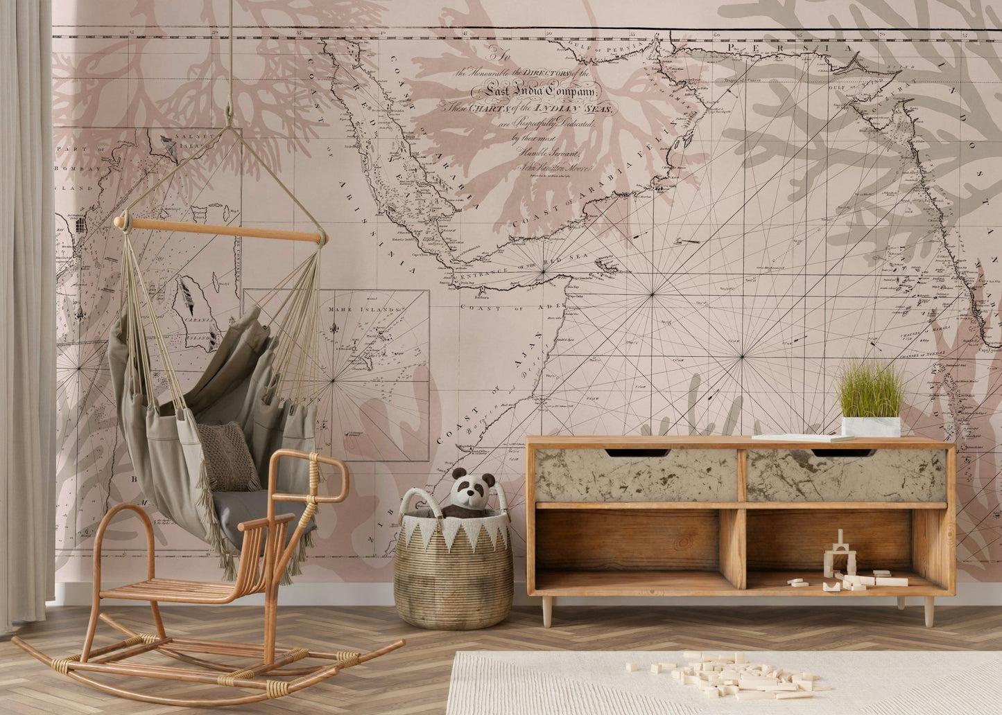 Wall mural with old-world map and greenery


