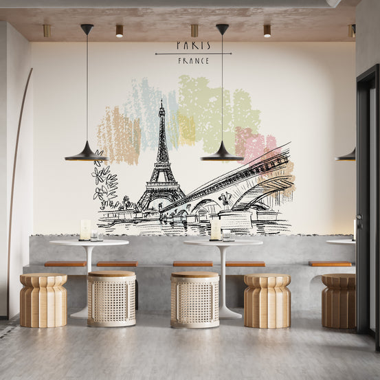 Eiffel Tower drawing wallpaper with Paris France text above white cafe tables and woven rattan stools