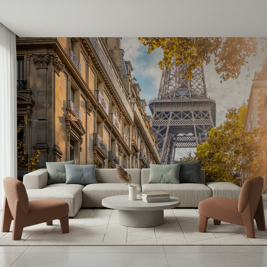 Eiffel's Golden Hour wallpaper mural of the Eiffel Tower down a Paris street behind a gray sofa and rust chairs