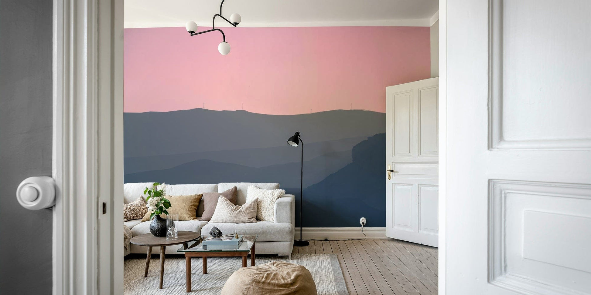 The wallpaper is used as a feature wall in a bedroom.

