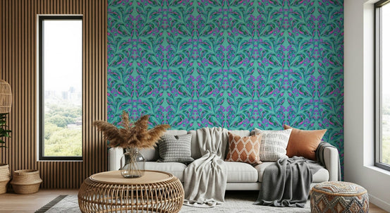 Electric Berries and Bloom wallpaper in turquoise and purple behind a grey sofa with a wood-slat wall