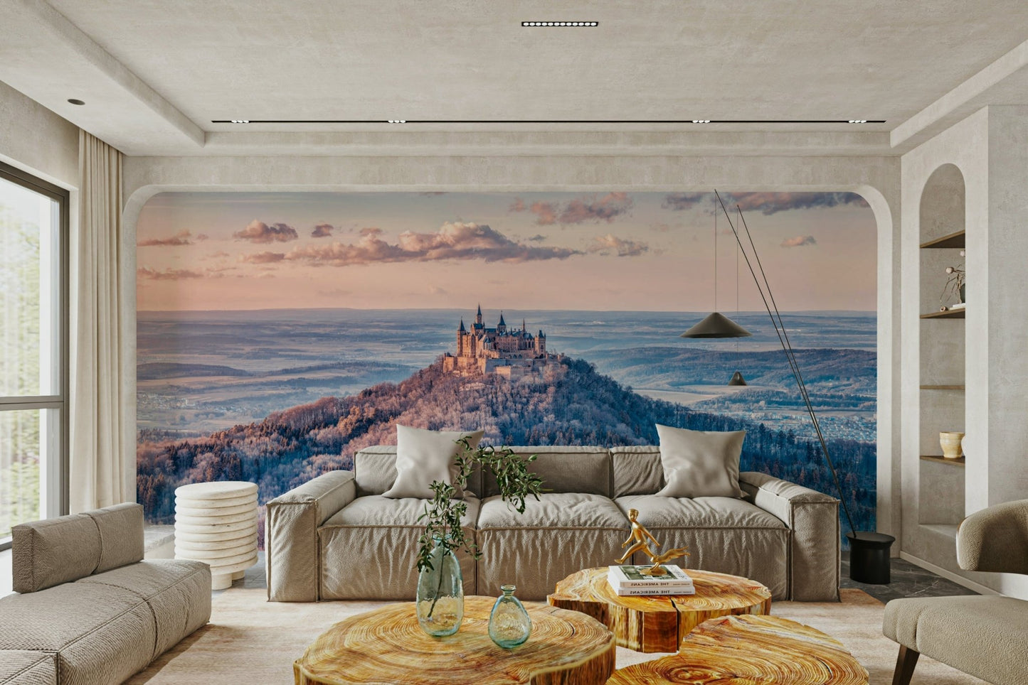 The room feels expansive and dramatic due to the grand landscape.

