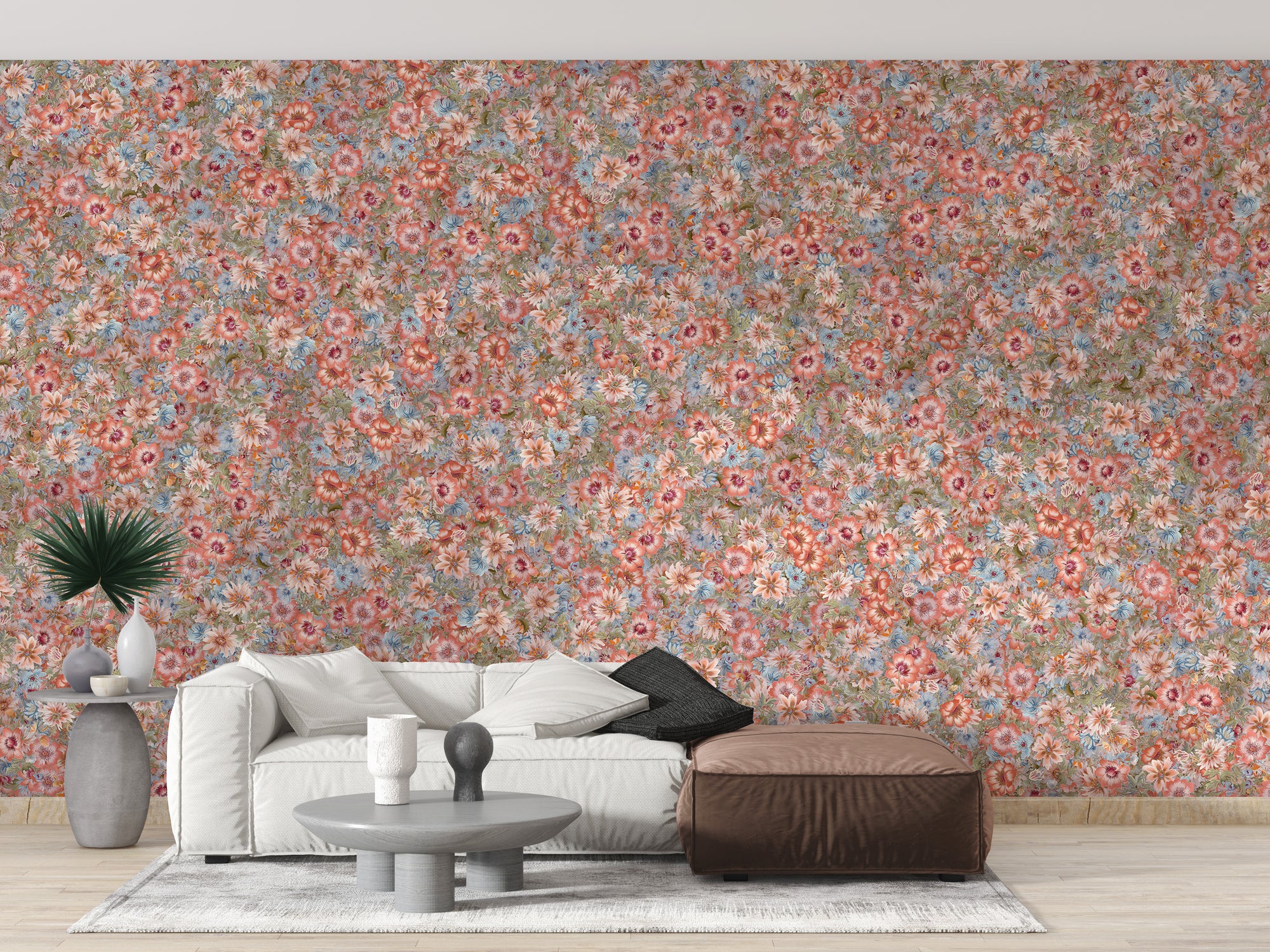Embroidery Orange Summer Flowers wallpaper mural of coral and blue blooms behind a white sofa and ottoman