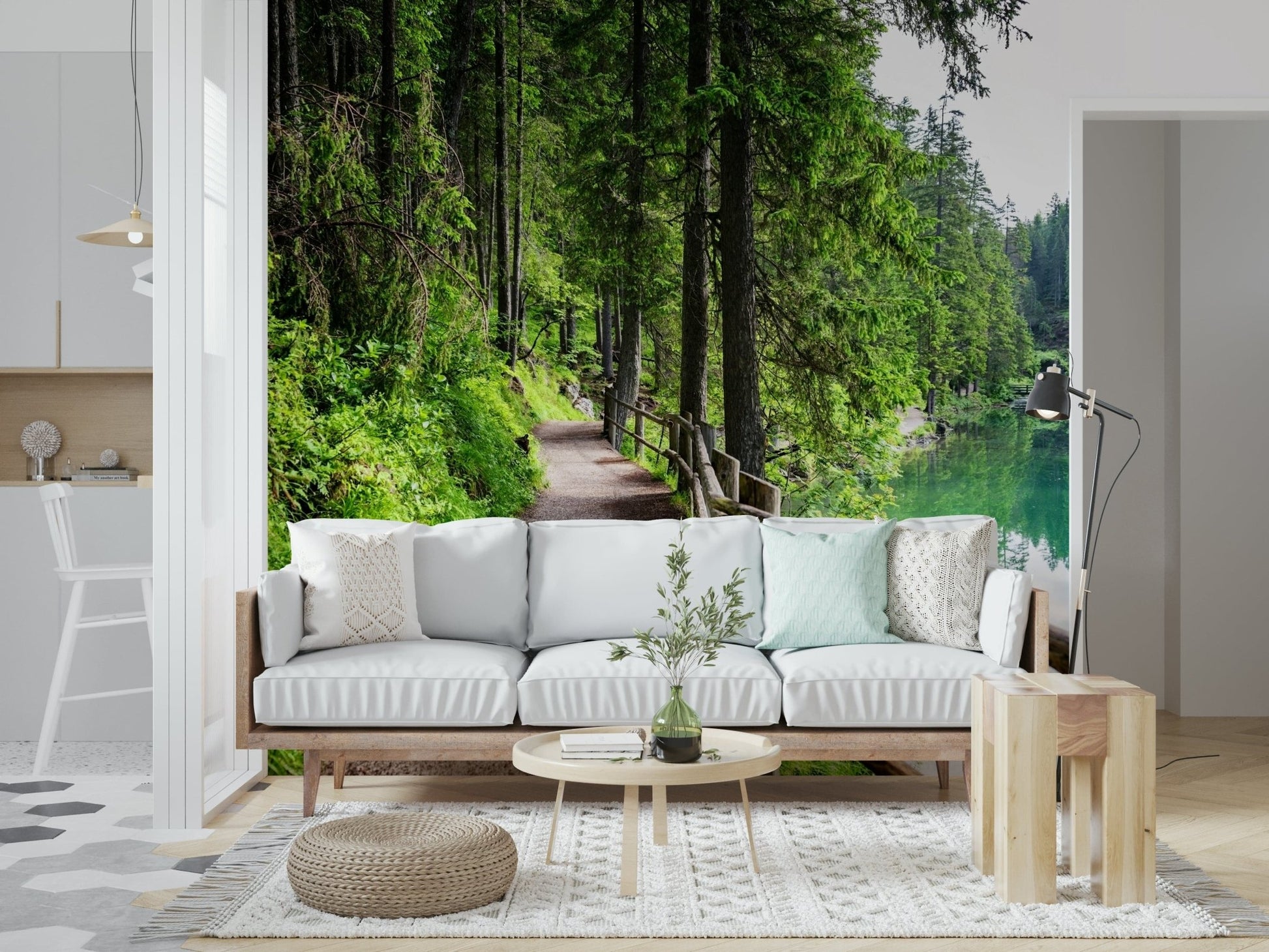 Scenic emerald lake mural behind grey couch, modern living space nature wall