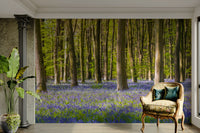 The mural shows a serene, tree-lined road.

