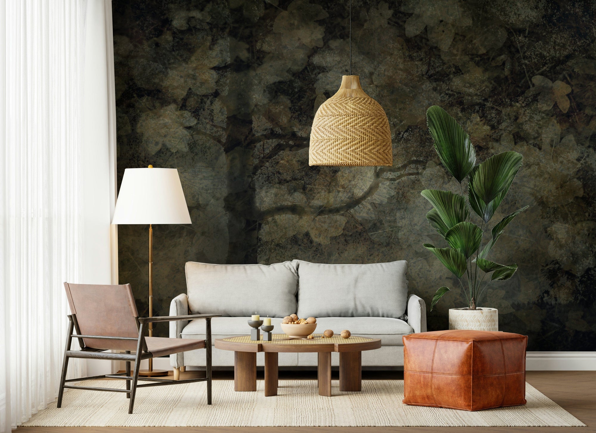 Ethereal Canopy wallpaper mural of a dark dreamy forest behind a grey sofa, leather sling chair and woven pendant