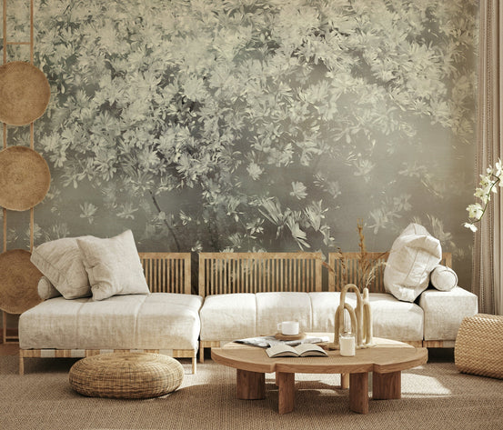 Ethereal Bloom Tree wallpaper mural of white blossoms above a low cream sectional and round coffee table