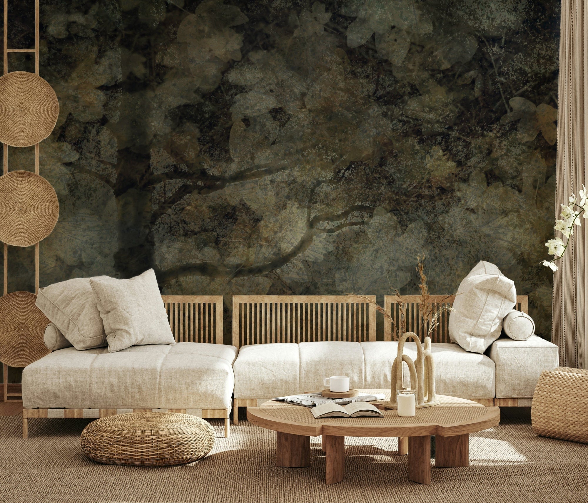 Ethereal Woodland wallpaper mural of a moody dark forest behind cream low sofas and a round wood table in a boho living room