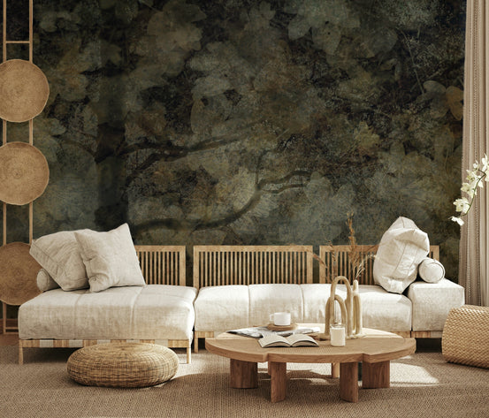 Ethereal Woodland wallpaper mural of a moody dark forest behind cream low sofas and a round wood table in a boho living room