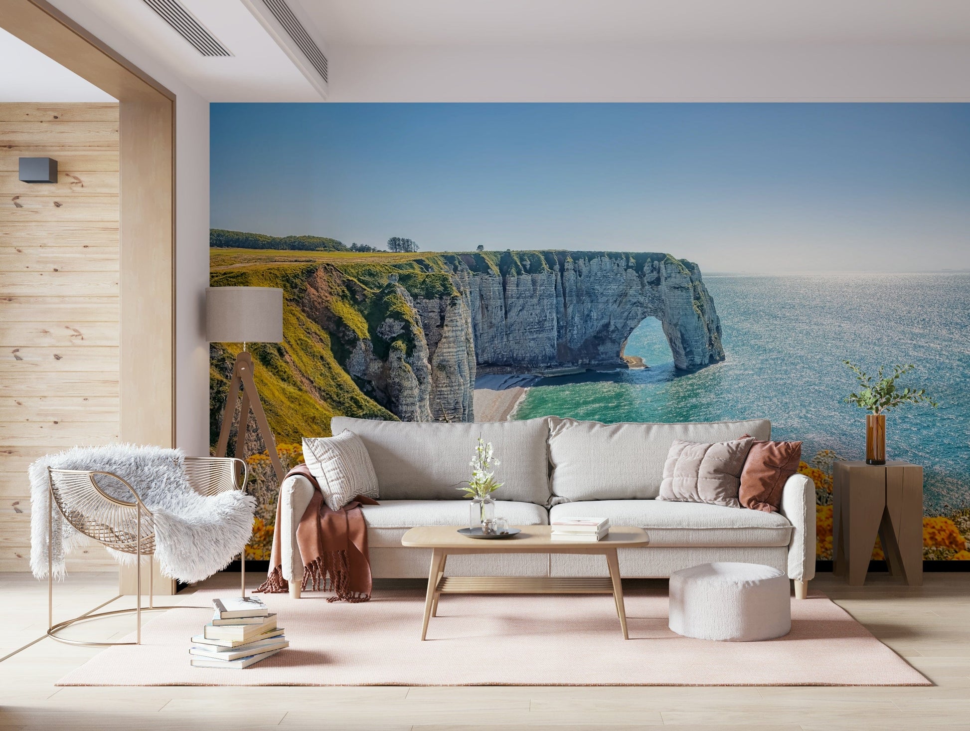 Etretat cliff arches wall mural with yellow blooms, green color shades and sea wallpaper waterline