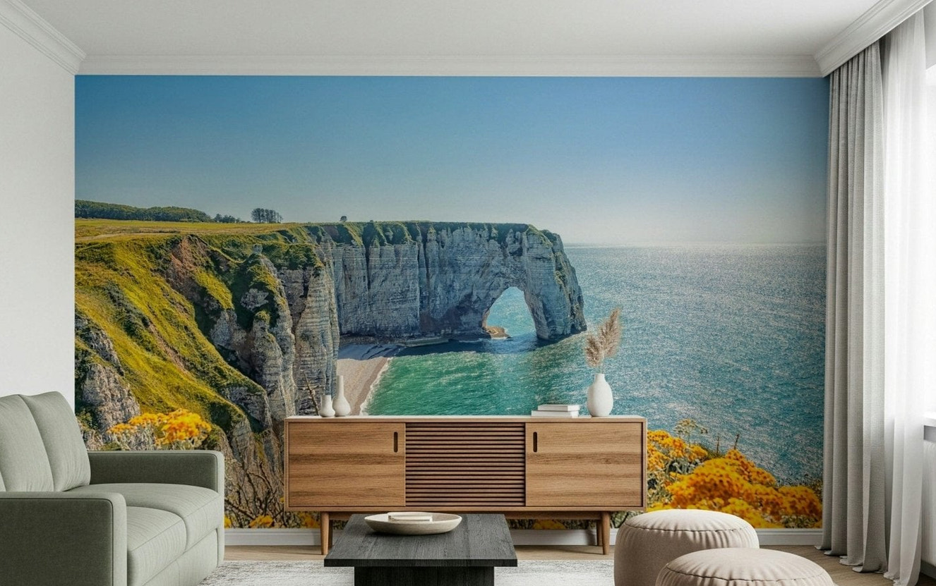 Yellow bloom wall mural on rocky coast, balanced green color details and ocean wallpaper backdrop