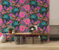 Exotic Bloom wallpaper of parrots and flowers above a wood console bench with woven baskets in an entryway