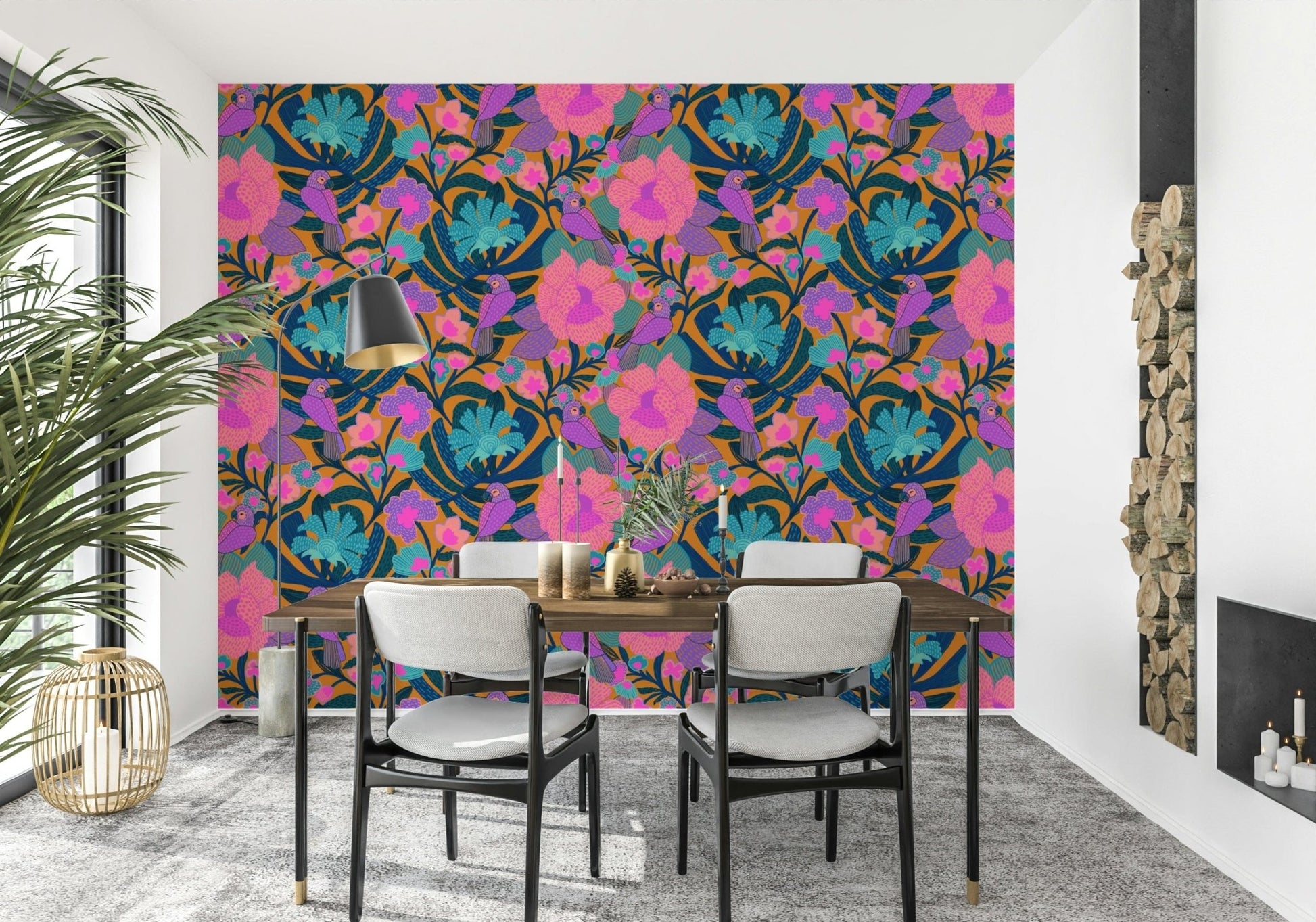 Exotic Bloom wallpaper behind a wood dining table and grey chairs beside stacked firewood and a palm