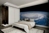 A wall mural of a storm seen from the eye or center.
