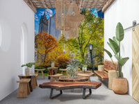 Central Park in Fall Colors, large tree foreground, impressive tall buildings looming.
